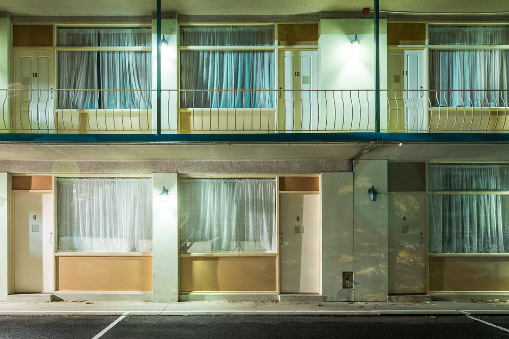 Clarendon Guest House at Hotel Motel 101, two storeys of identical rooms face the car park.