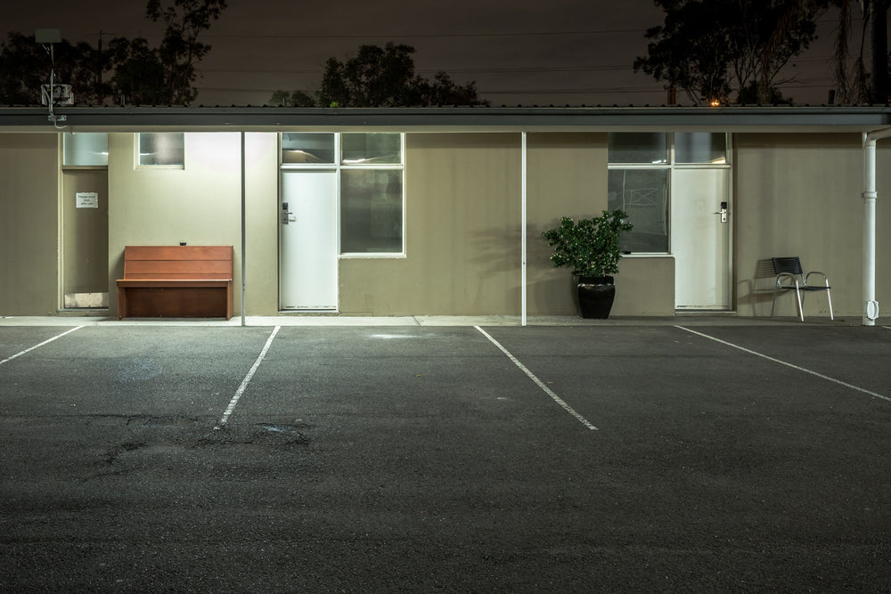 Colyton Hotel at Hotel Motel 101, a single-storey motel block sits flat against the night.
