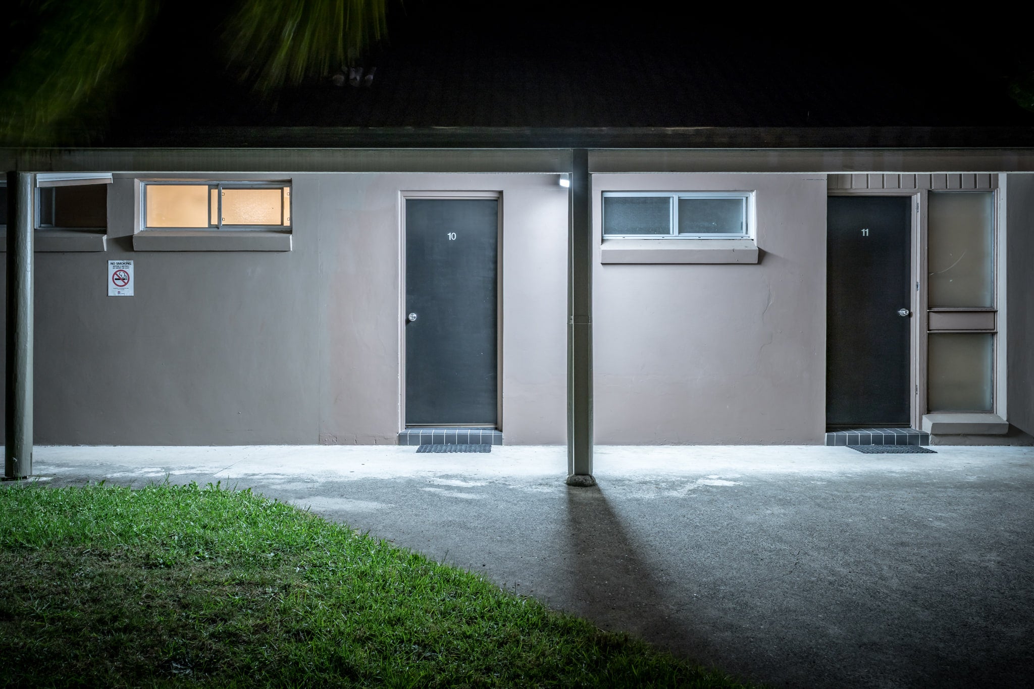 Comfort Inn Towradgi Beach at Hotel Motel 101, two doors sit side by side in a single-storey concrete block building.