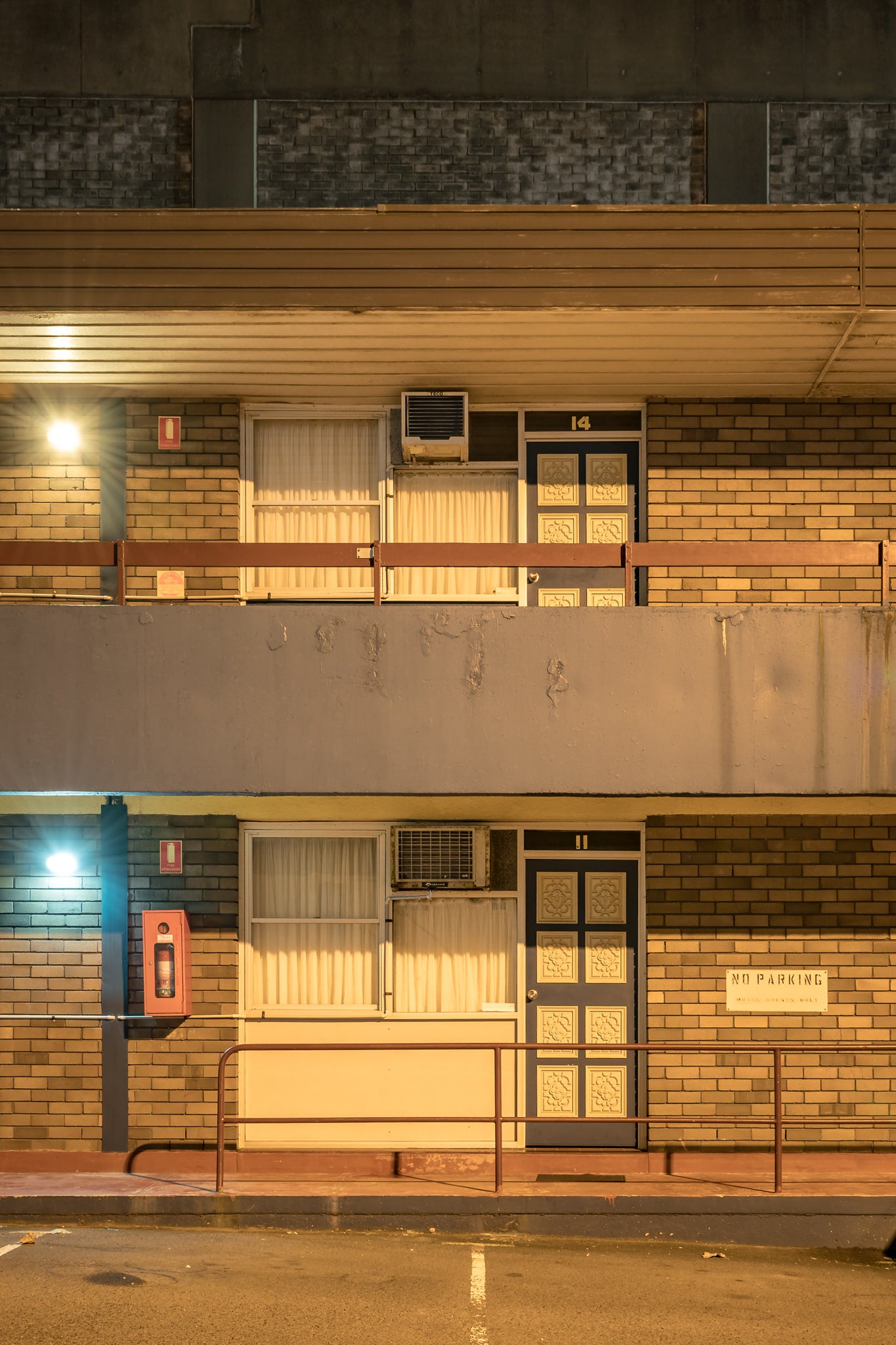 Downtown Motel at Hotel Motel 101, two storeys of brown brick and concrete slab.