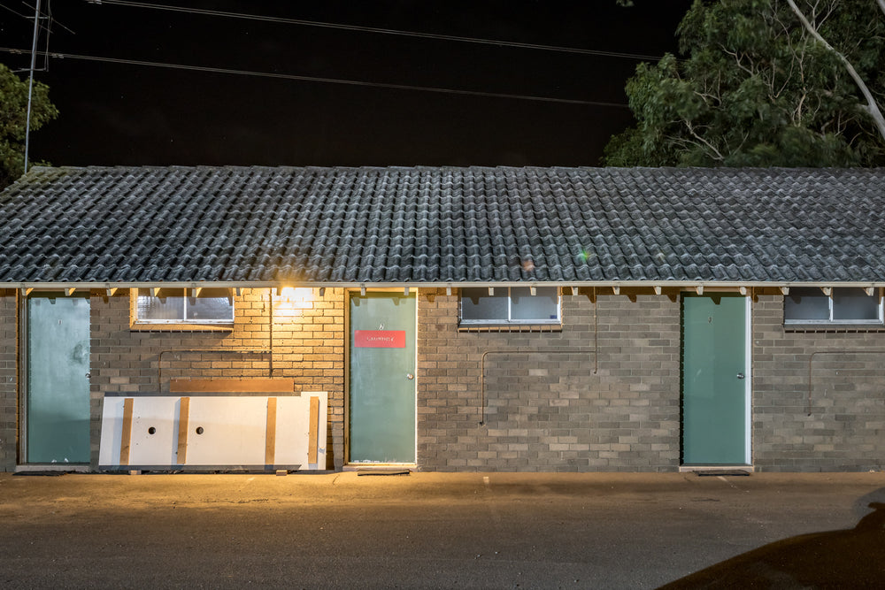 Gateway Motel at Hotel Motel 101, a single-storey brick motel block sits flat against the night.