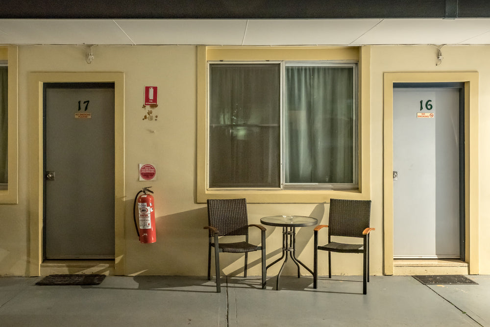 High Mountains Motor Inn at Hotel Motel 101, rooms 16 and 17 sit side by side beneath a concrete awning.