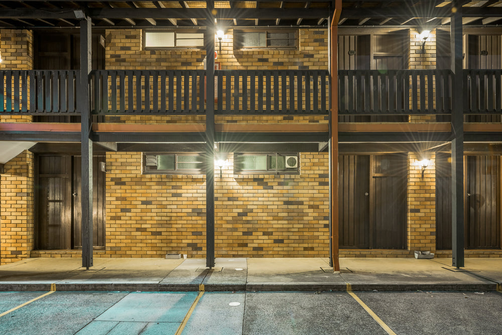 Maclin Lodge Hotel at Hotel Motel 101, two storeys of brown and tan brick face the empty car park.