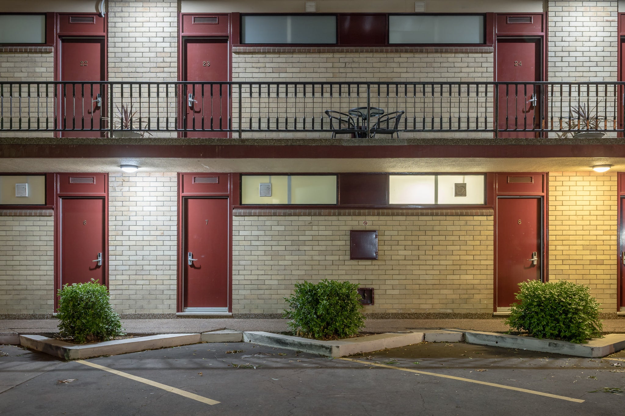 Red Star Hotel at Hotel Motel 101, two storeys of cream brick and dark red doors.