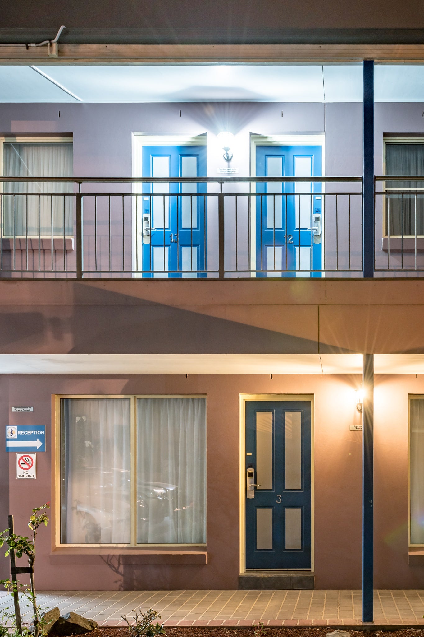 Shellharbour Village Motel at Hotel Motel 101, two storeys of rendered concrete and steel balustrade.