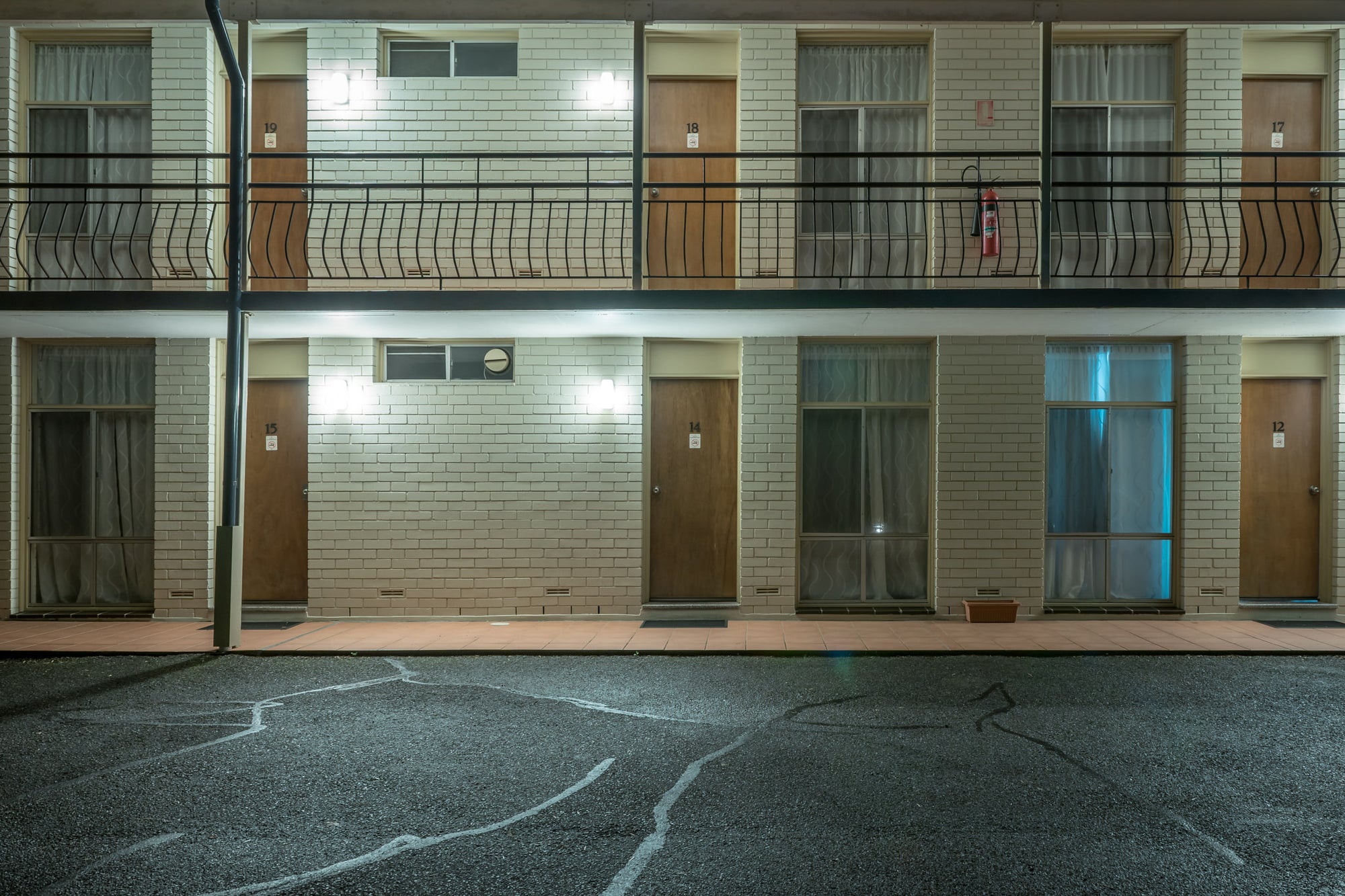 Waterview Gosford Motor Inn at Hotel Motel 101, two storeys of cream brick face an empty car park.
