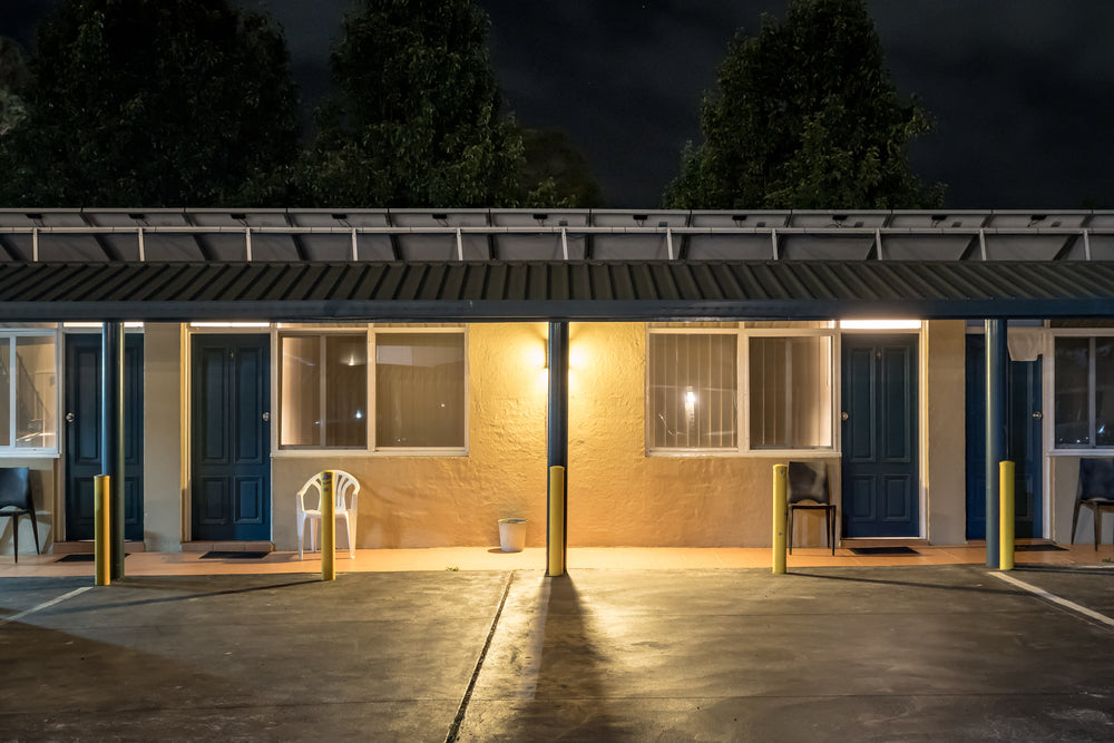 Windsor Motel at Hotel Motel 101, two rooms face the car park under a low corrugated steel awning.