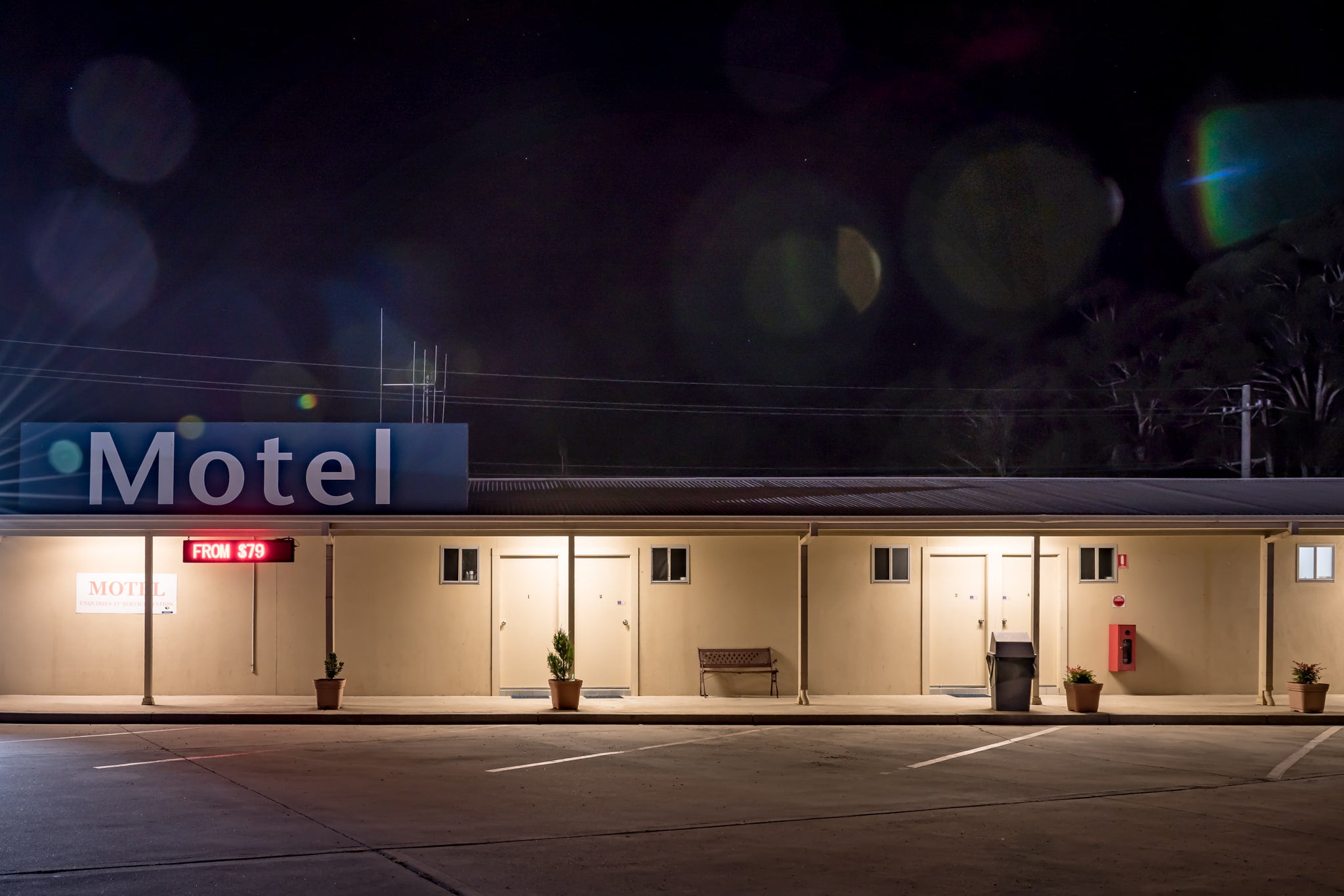 Yetholme Motor Inn at Hotel Motel 101, a single-storey motel stretches low across the frame under a black sky.