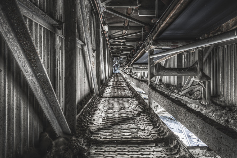 Cement Mill Conveyor at Kandos Cement Works, a narrow corridor stretches deep between corrugated iron walls.