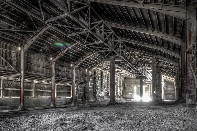Clinker Shed at Kandos Cement Works, steel trusses span the full width of the shed, supported by heavy columns streaked.