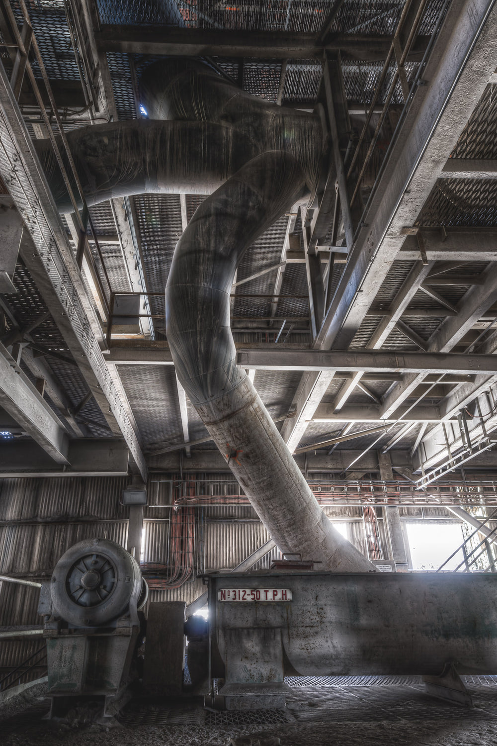 Grit Return Screw at Kandos Cement Works, overhead, the ducting twists and bends through the structure - a later addition.