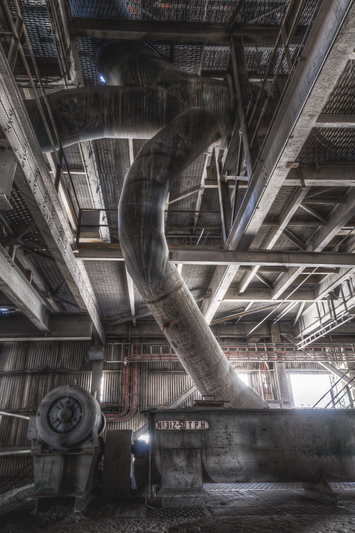 Grit Return Screw at Kandos Cement Works, overhead, the ducting twists and bends through the structure - a later addition.