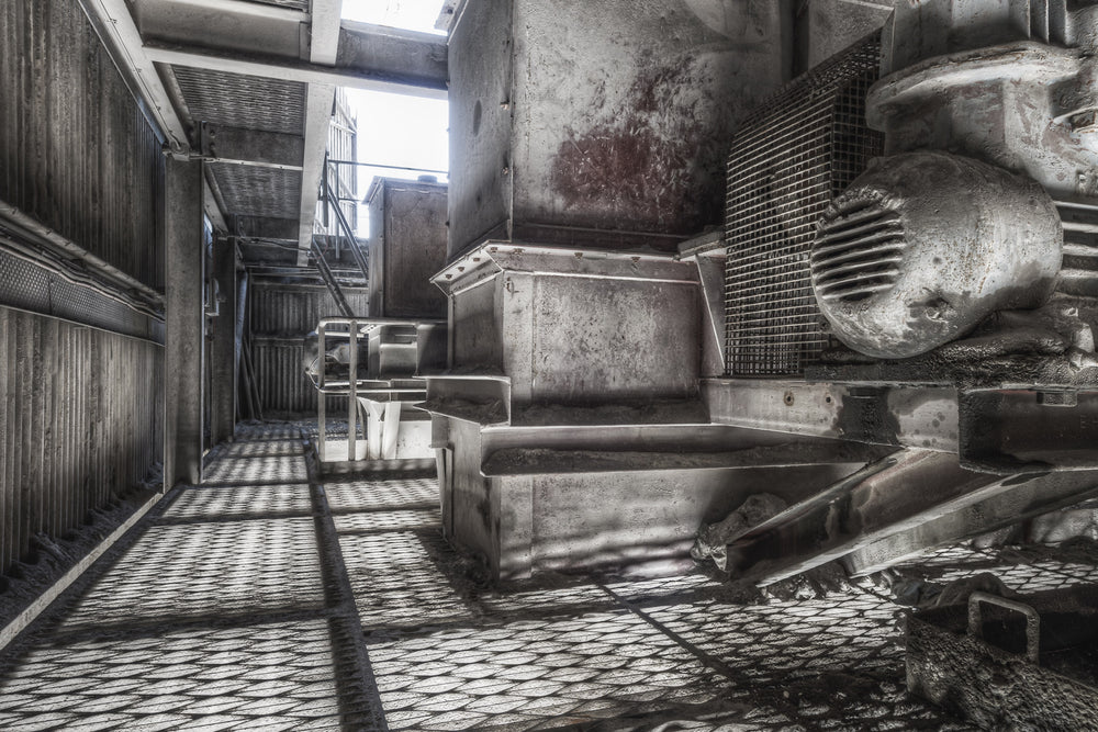 Kiln Feed Station at Kandos Cement Works, a heavy gearbox drive sits low against the concrete floor, its casing thick.