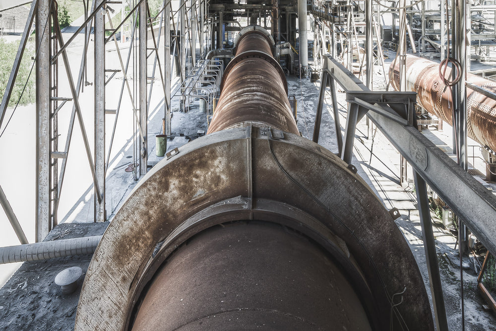 No 6 Kiln at Kandos Cement Works, a massive rotary kiln stretches deep into the frame, its steel barrel dark with heat.