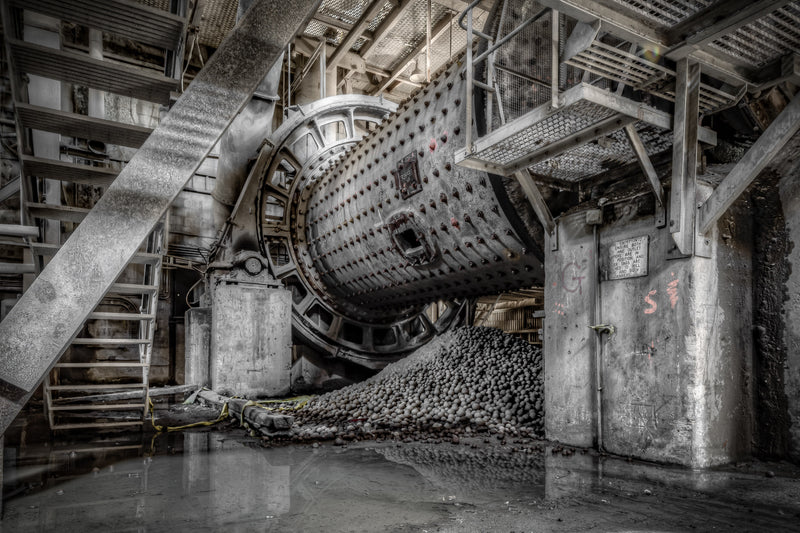 Number Six Raw Mill at Kandos Cement Works, a ball mill sits heavy in the half-light, its riveted steel drum tilted toward.