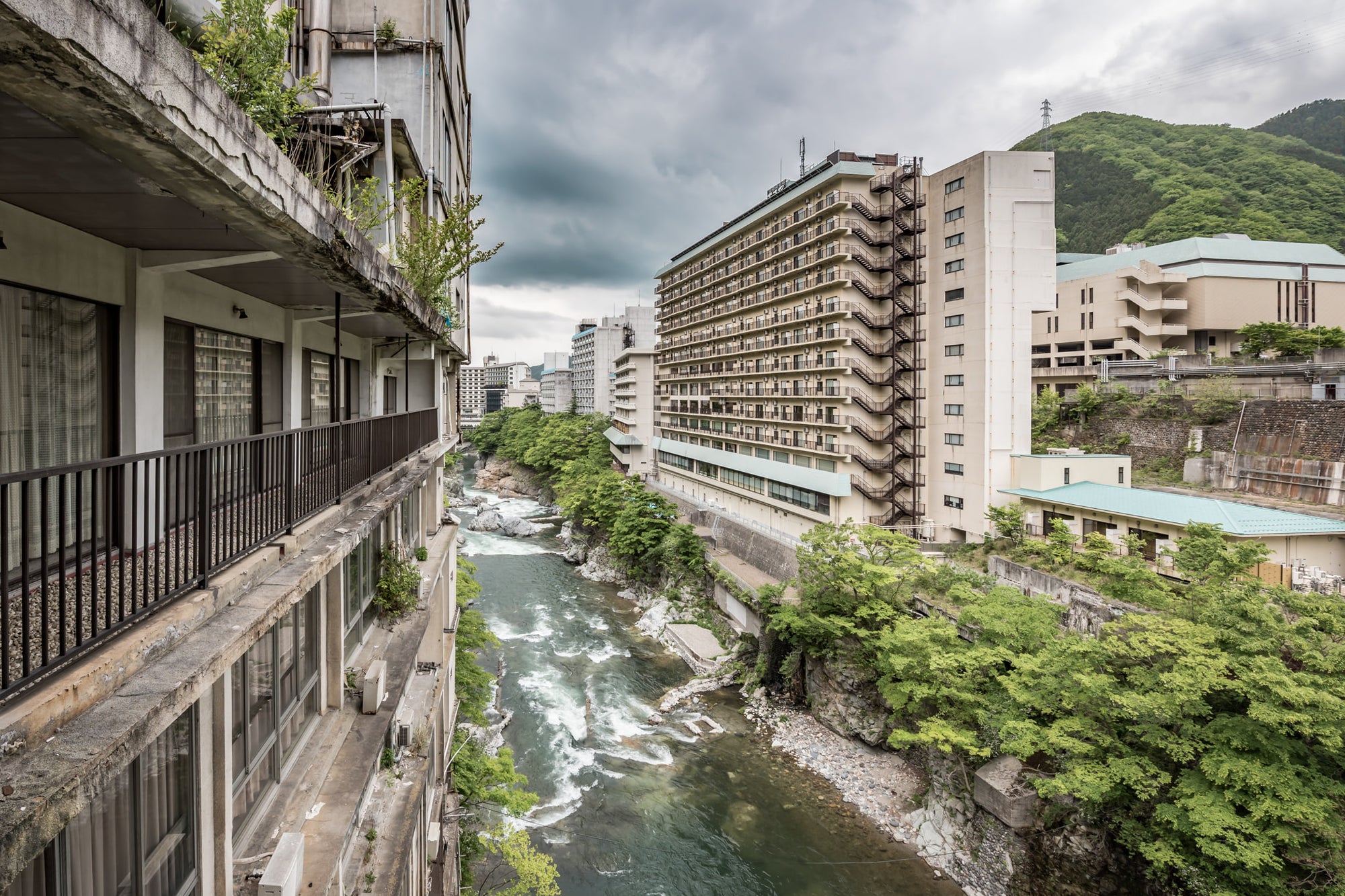 Balcony Looking Downstream at Kinugawa Kan, perched on the crumbling balcony of Kinugawa Kan, the view down the valley.