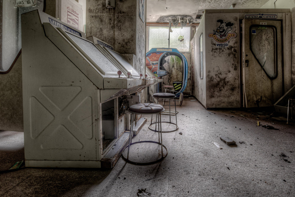Games Room at Kinugawa Kan, a JVC Victor karaoke machine sits against the left wall, two chrome stools still positioned.