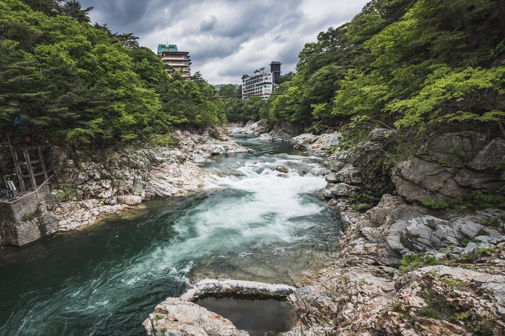 Kinugawa River at Kinugawa Kan, the abandoned Kinugawa Kan hotel complex overlooks the Kinugawa River.