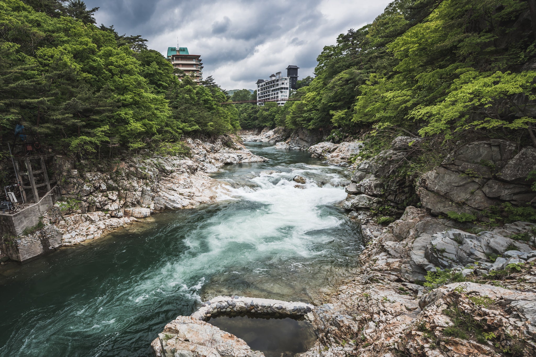 Kinugawa River at Kinugawa Kan, the abandoned Kinugawa Kan hotel complex overlooks the Kinugawa River.