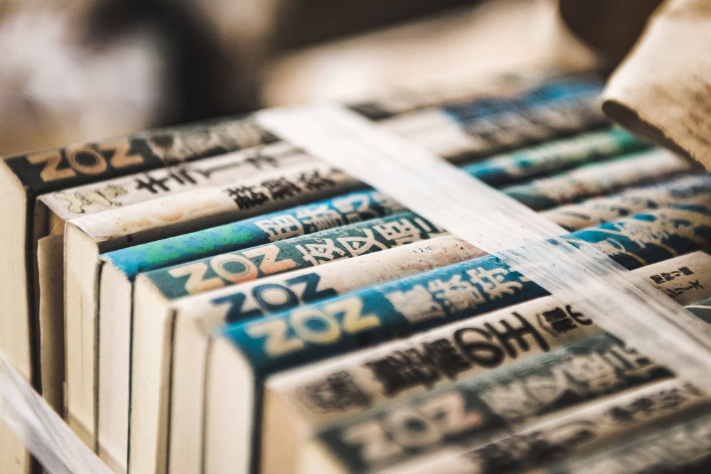Books at Kuwashima Hospital, a bundle of Japanese paperbacks sits tightly bound with packing tape.