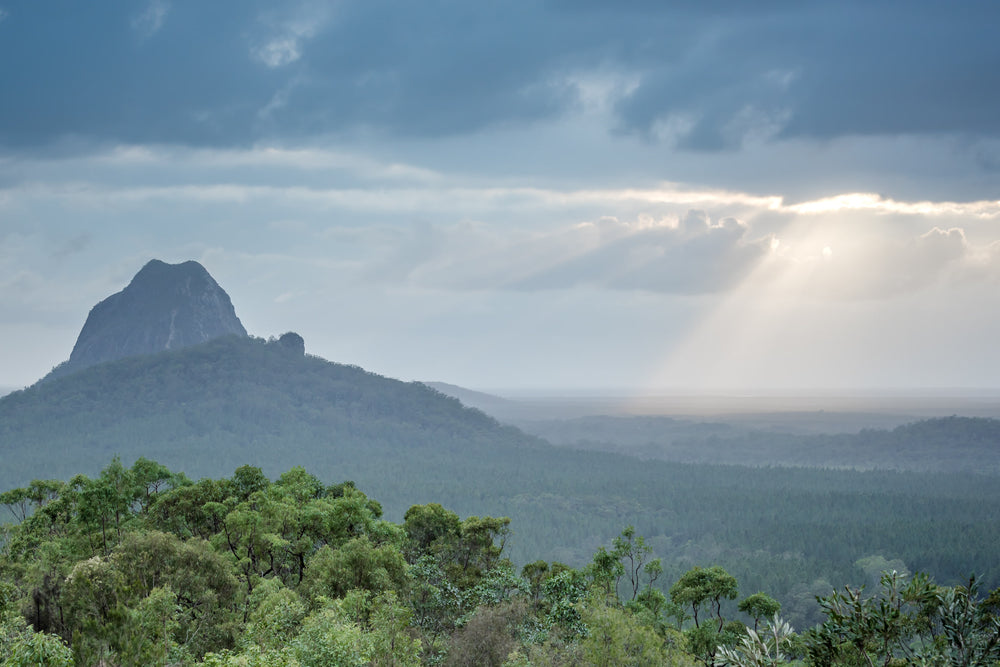 Glasshouse Sun Rays at Landscapes, sun Streaking through the clouds over the Glasshouse Mountains.