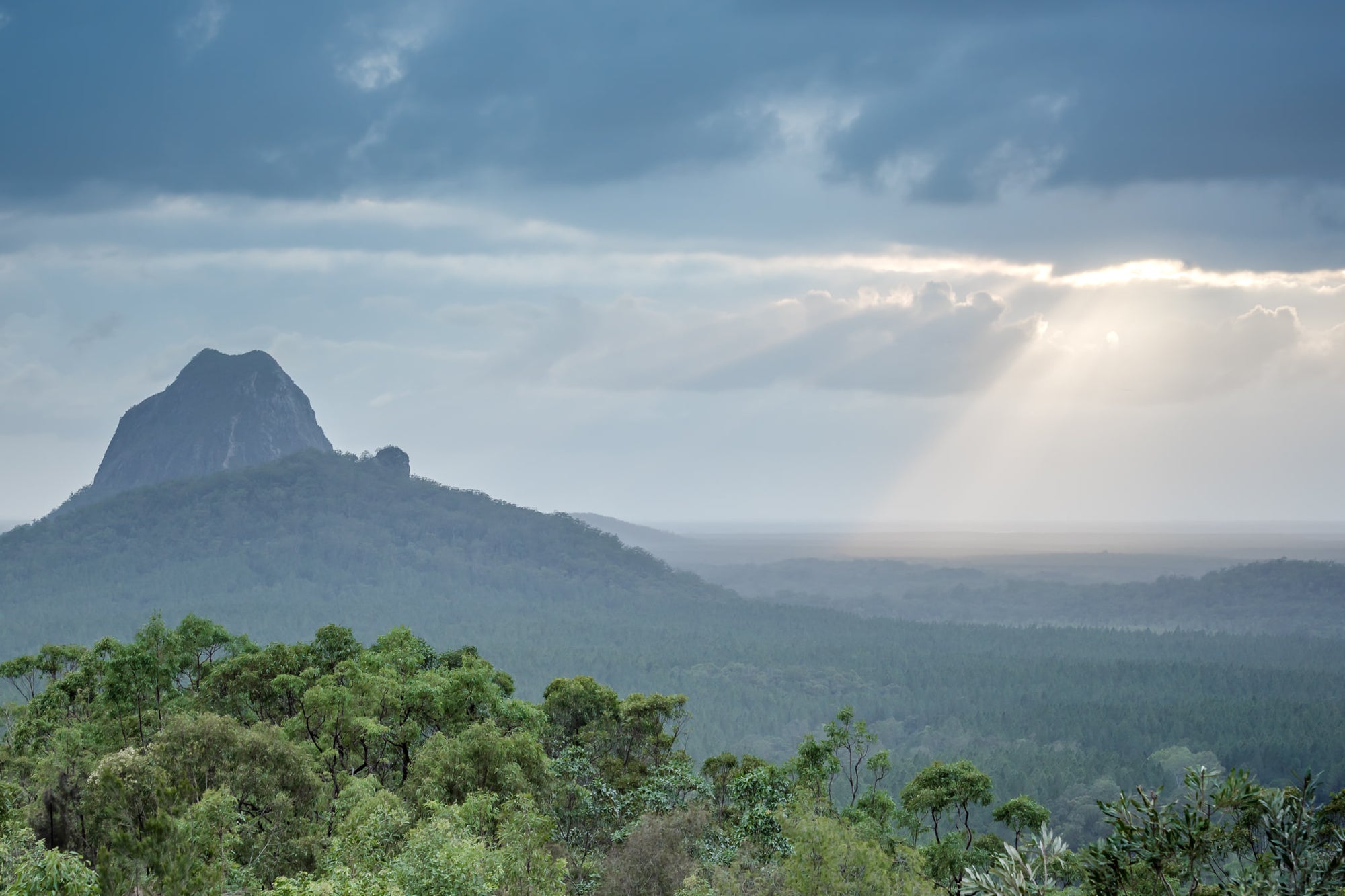 Glasshouse Sun Rays at Landscapes, sun Streaking through the clouds over the Glasshouse Mountains.