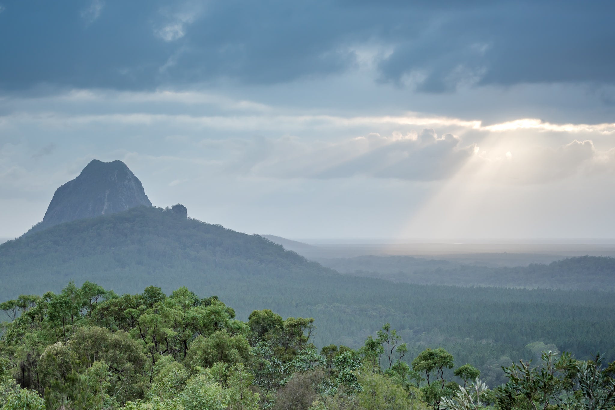Glasshouse Sun Rays at Landscapes, sun Streaking through the clouds over the Glasshouse Mountains.