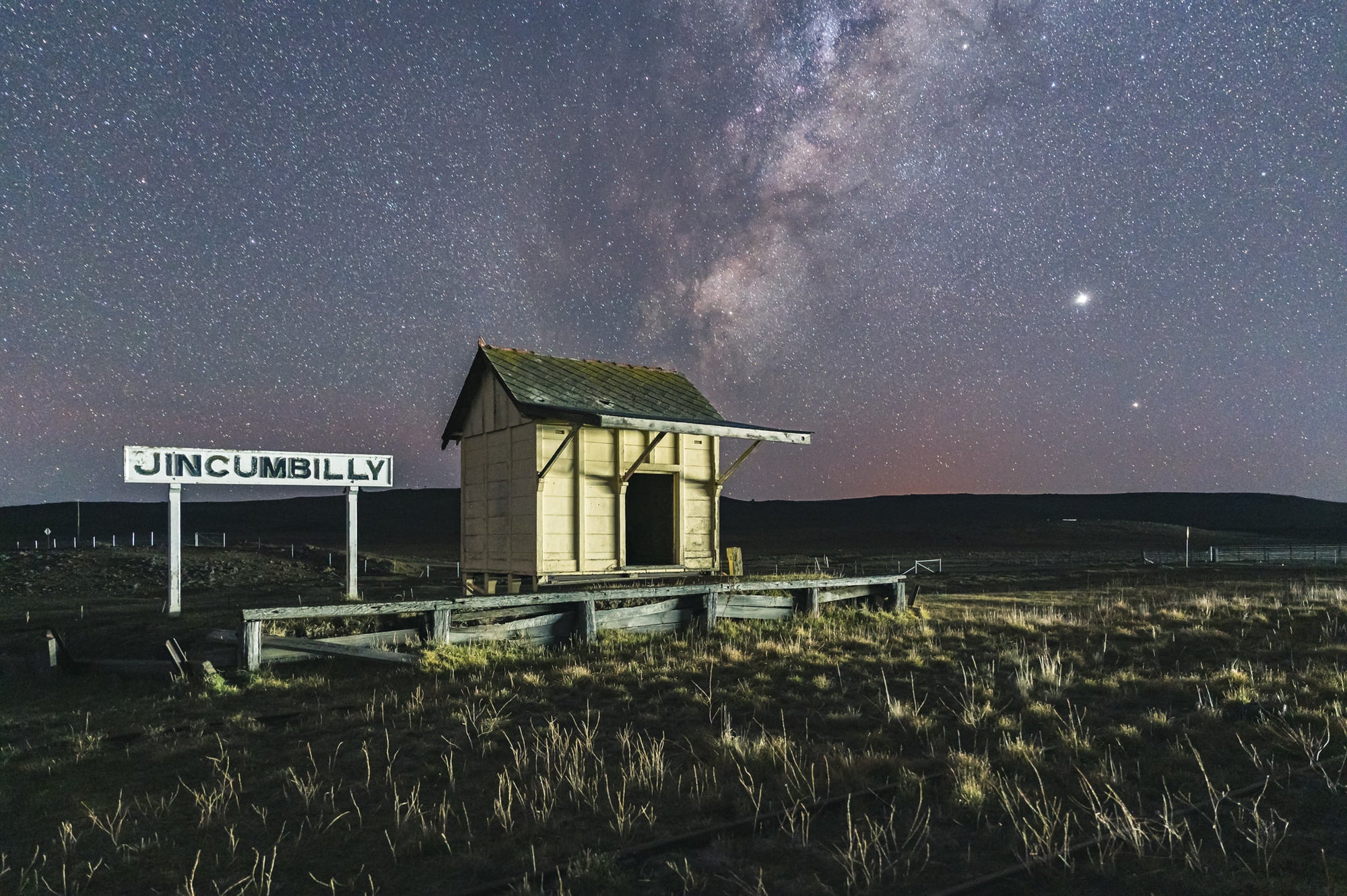 Jincumbilly Nightscape at Landscapes, a single timber shelter sits on a low weathered platform at Jincumbilly.