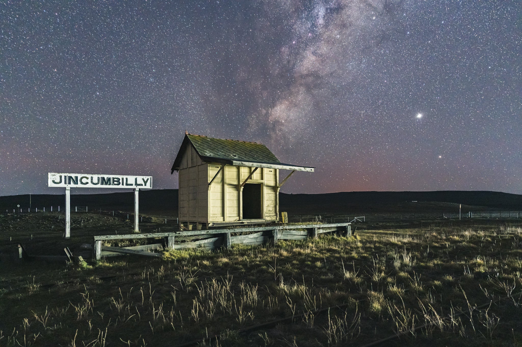 Jincumbilly Nightscape at Landscapes, a single timber shelter sits on a low weathered platform at Jincumbilly.
