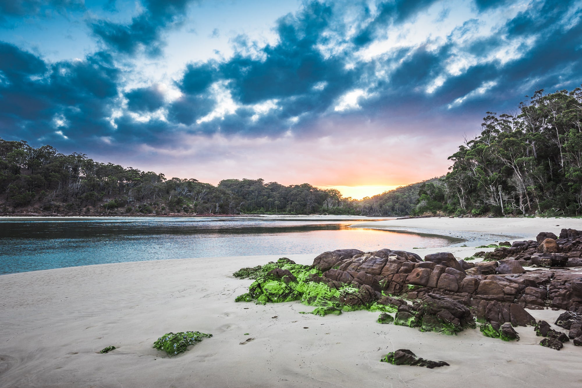 Pambula River Sunset at Landscapes, a golden sunset fades over Pambula River as the blue of the night sky sets in.