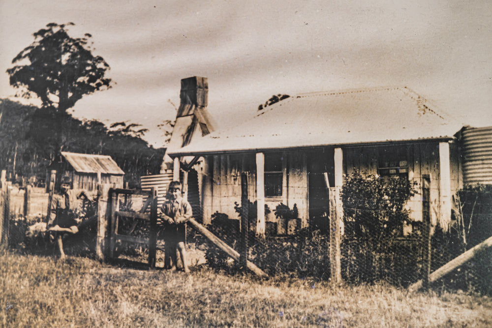 History at Leichhardt House, a sepia-toned archival photograph sits within the frame.