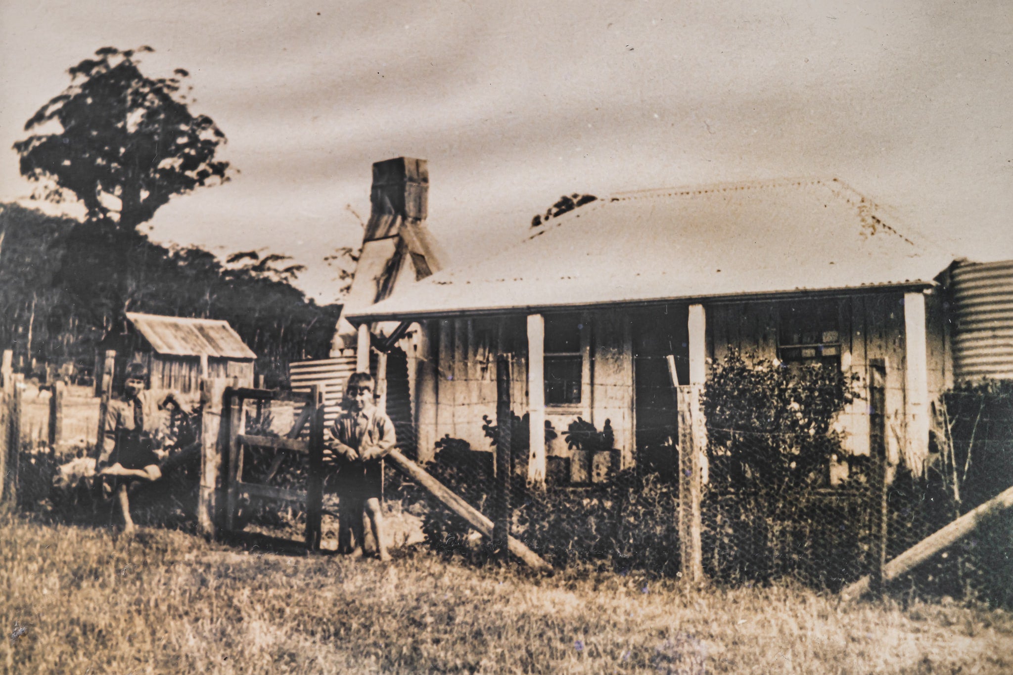 History at Leichhardt House, a sepia-toned archival photograph sits within the frame.