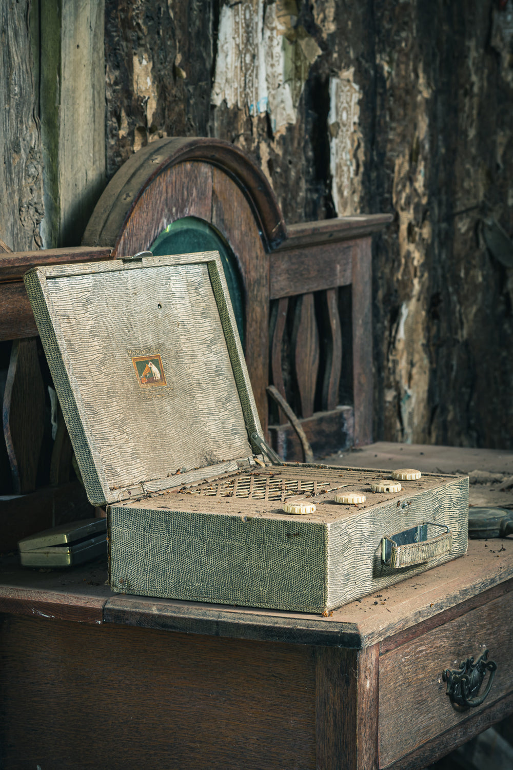 Wireless at Leichhardt House, a portable valve radio sits open on a dark timber dresser.