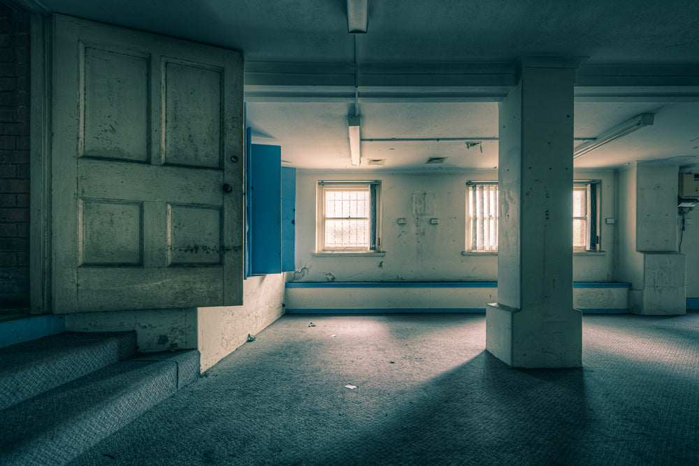 Basement Steps at Lewisham Hospital, cold light filters through barred windows into the basement level of Lewisham Hospital.