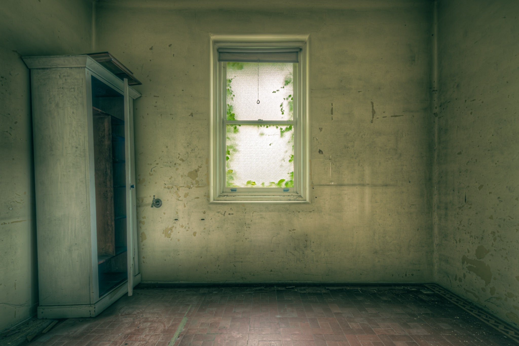 Frost at Lewisham Hospital, a single window fills the centre of a bare room.