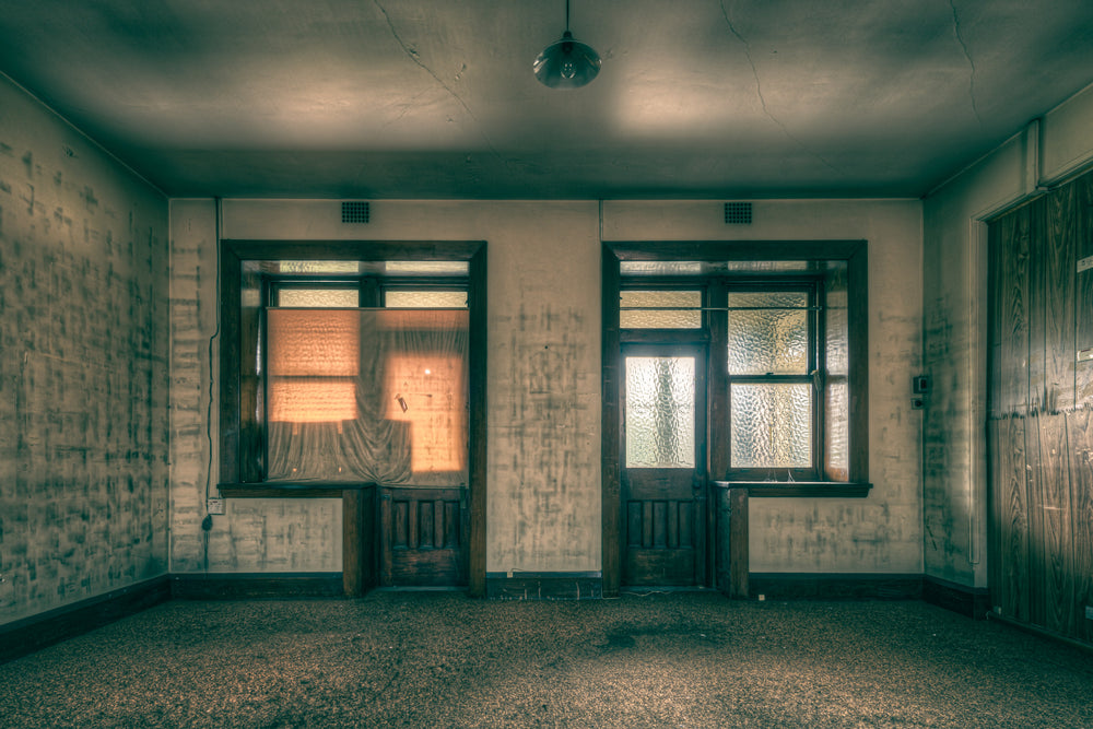 Glow at Lewisham Hospital, two windows face the far wall of an empty room.