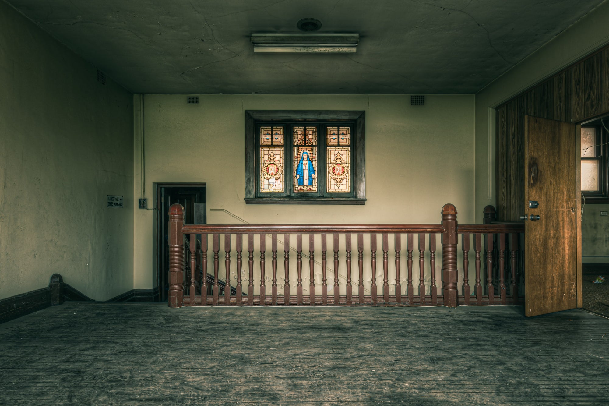 Mary at Lewisham Hospital, an upper-floor landing inside Lewisham Hospital.