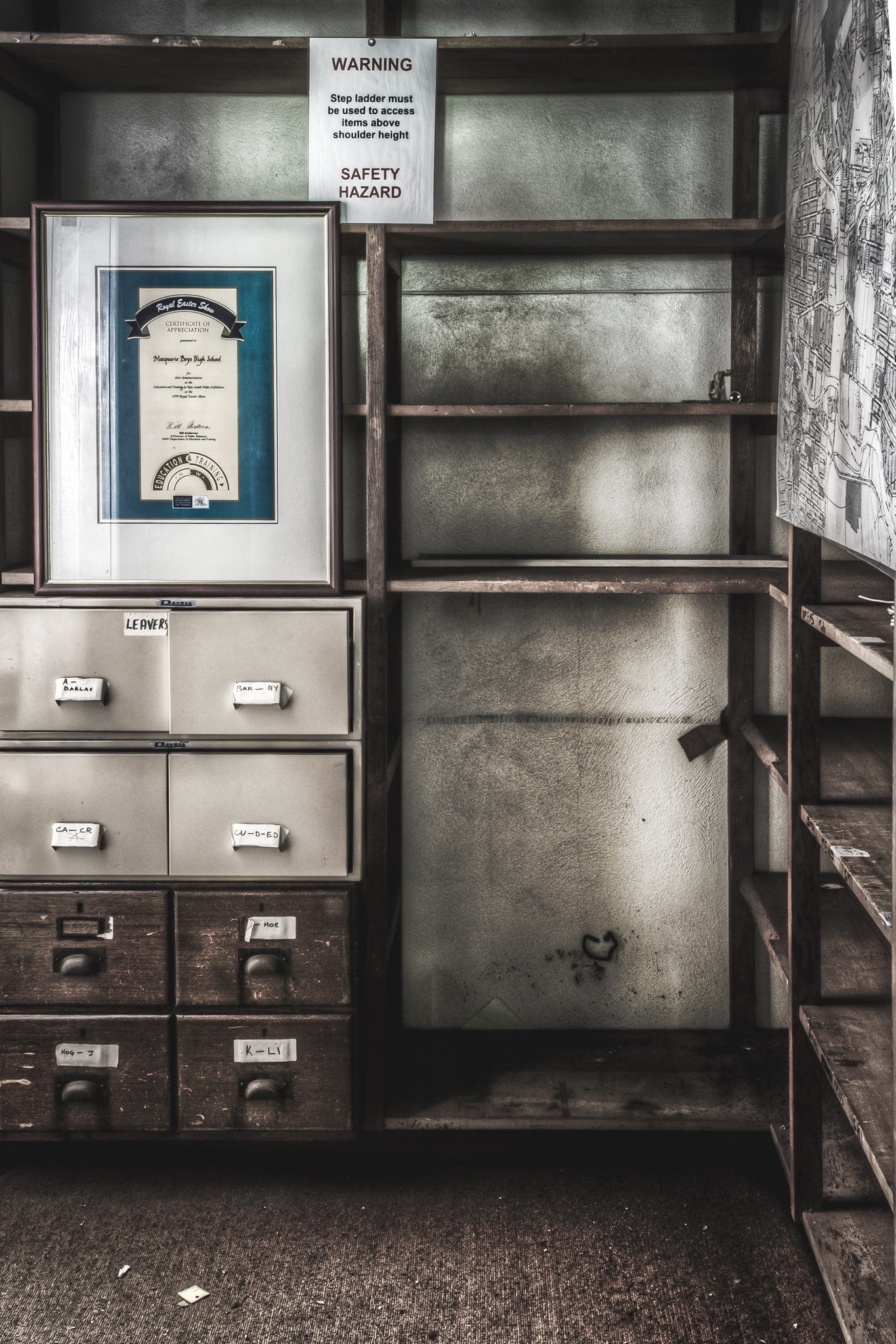 Student Records at Macquarie Boys Technology High, a filing cabinet sits against timber shelving inside the records office.