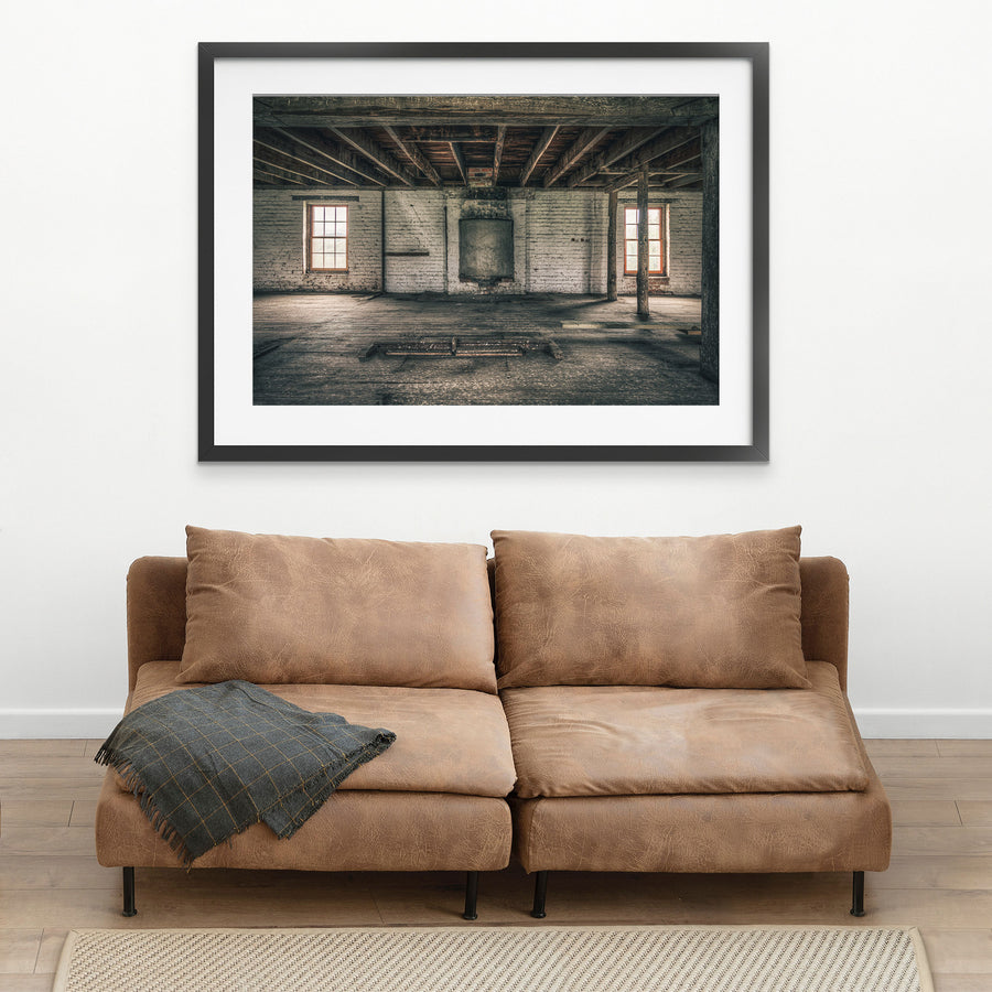 Upper room at Jembaicumbene mill, whitewashed brick walls and two sash windows over a bare timber floor.