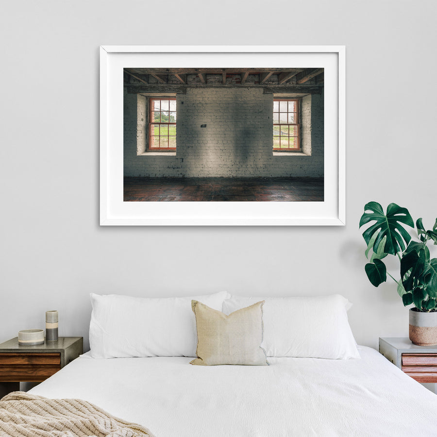 Twin timber sash windows at Jembaicumbene, whitewashed brick wall with exposed red brick reveals.