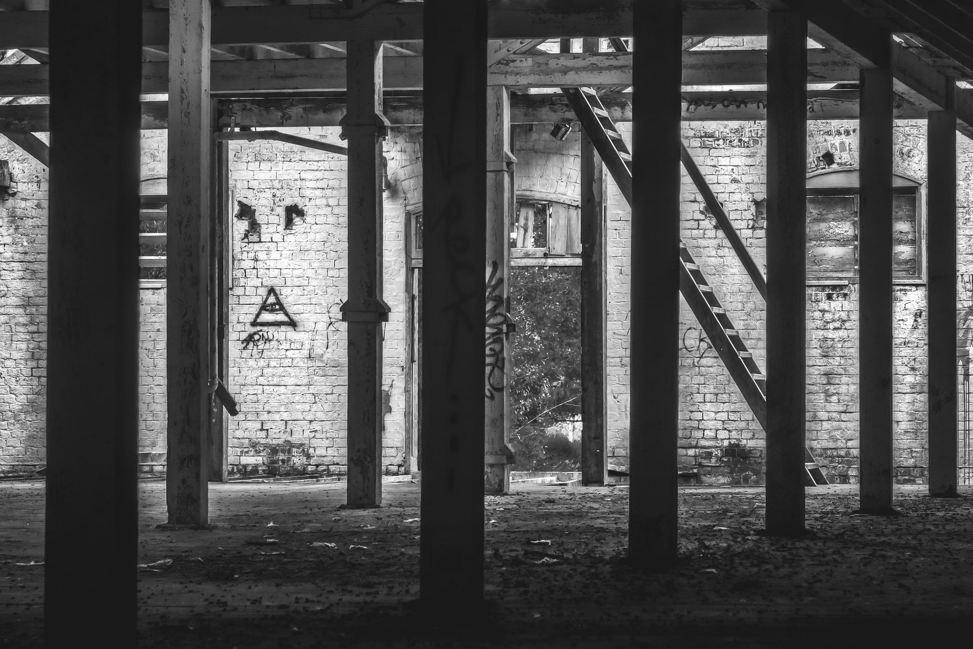 Malthouse One West at Mittagong Maltings, facing west through the silhouetted pylons supporting the attic space.
