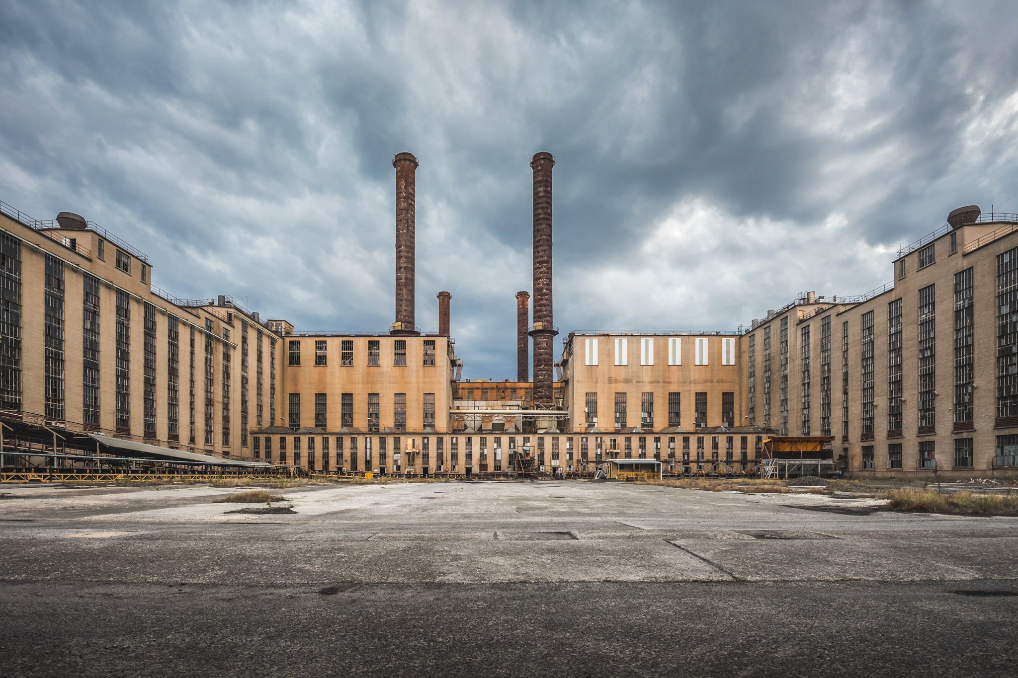 AB Launder Yard at Morwell Power Station, two brick chimneys rise from the centre of the frame, flanked by the symmetrical.
