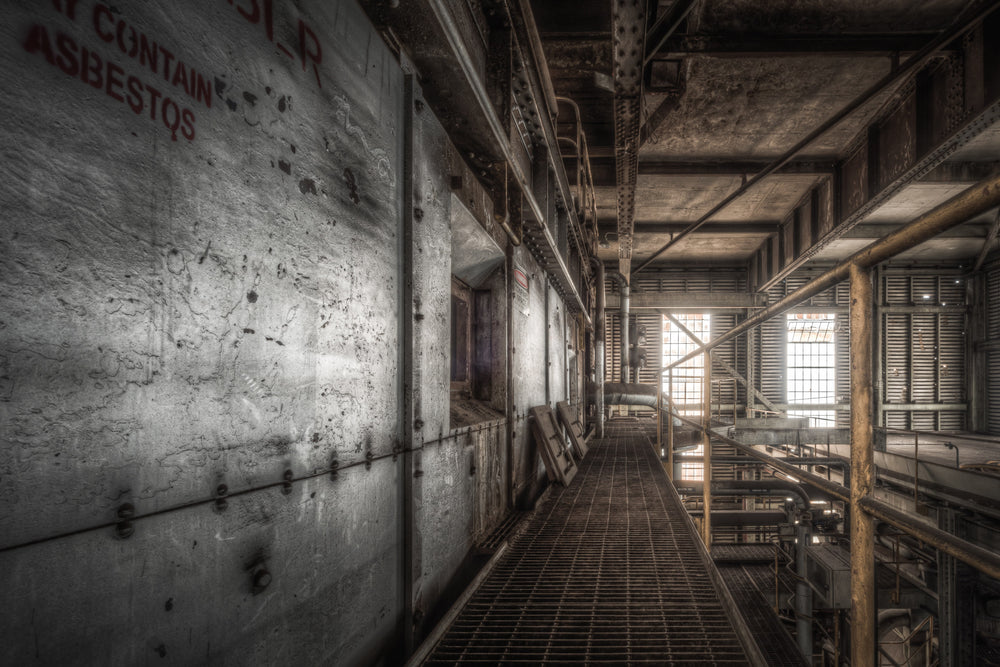 Boiler House at Morwell Power Station, a steel mesh walkway runs between concrete-clad boiler casings and a lattice of pipes.
