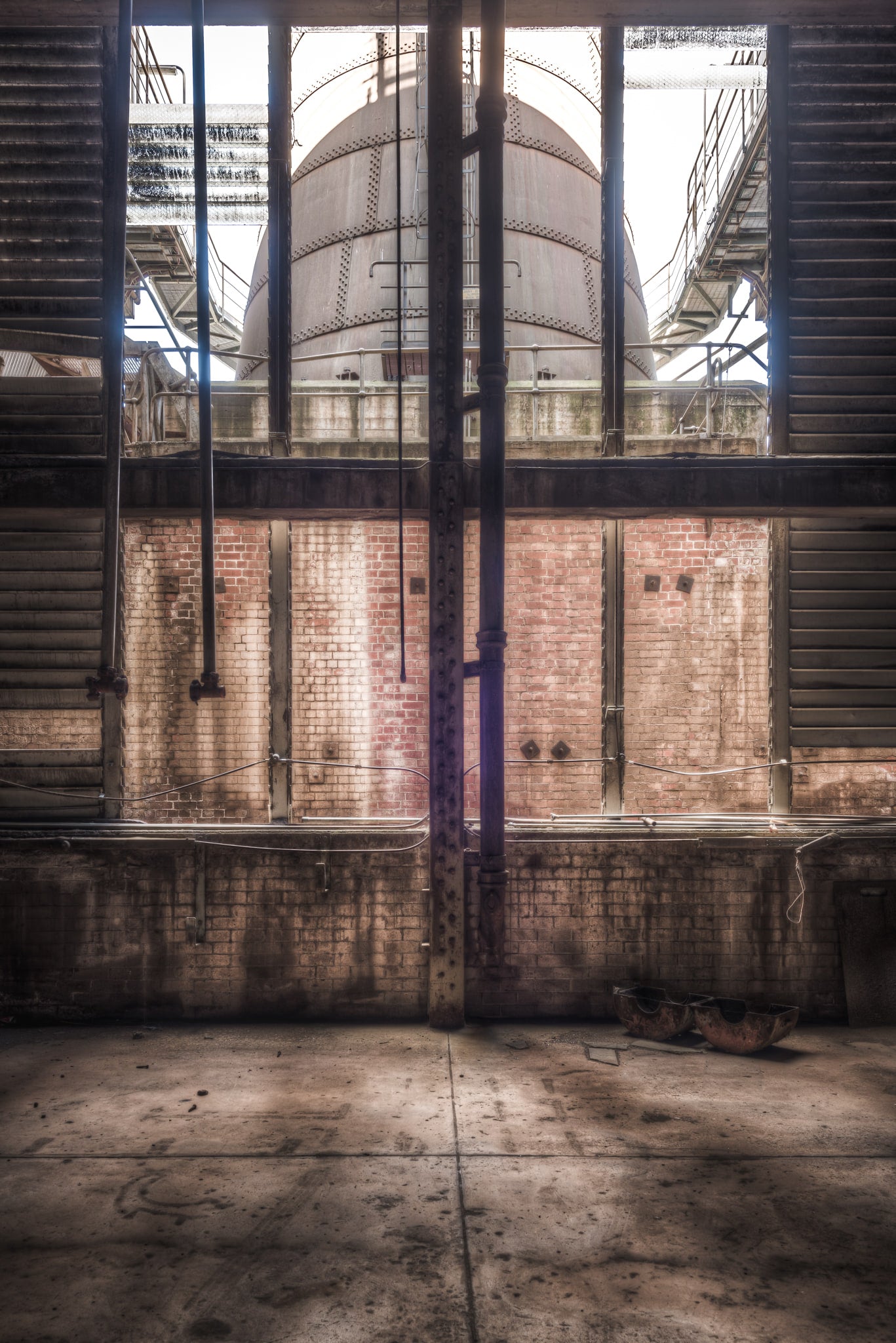 Bottom of Chimney at Morwell Power Station, someone left a hardhat on the floor of the chimney base.