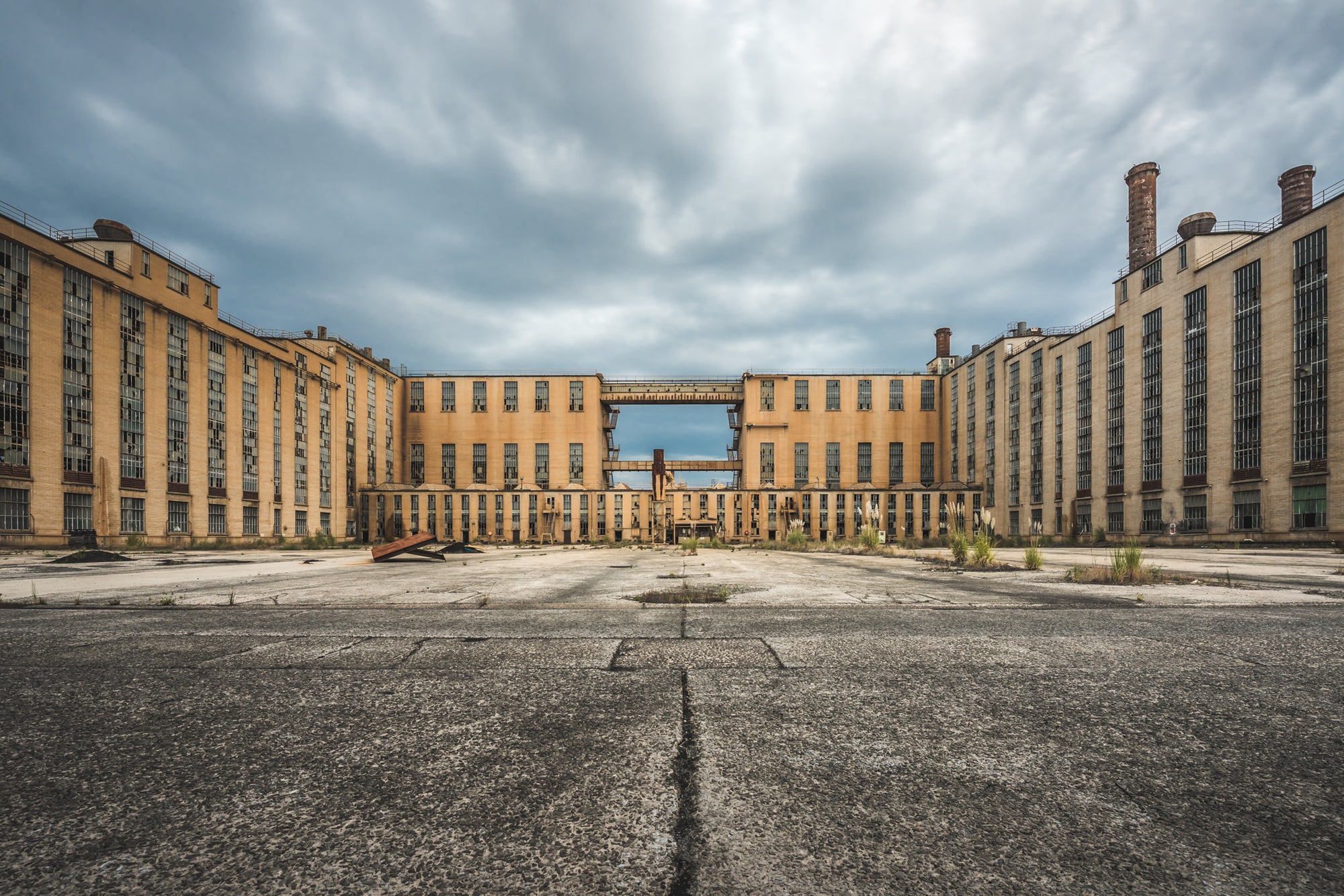C and D Factory at Morwell Power Station, two symmetrical wings of buff-coloured brick rise four storeys high, flanking.