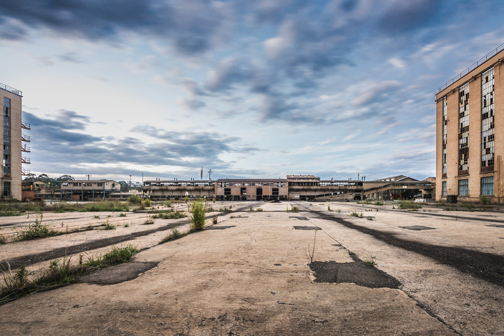 Collector Conveyors at Morwell Power Station, the collector yard empty now, weeds finding the cracks in the concrete.