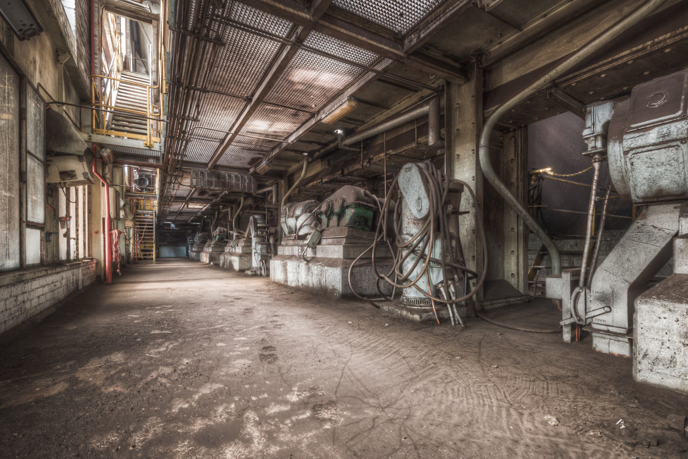 Dryer Motors at Morwell Power Station, heavy industrial dryer motors line the ground floor on concrete plinths,.