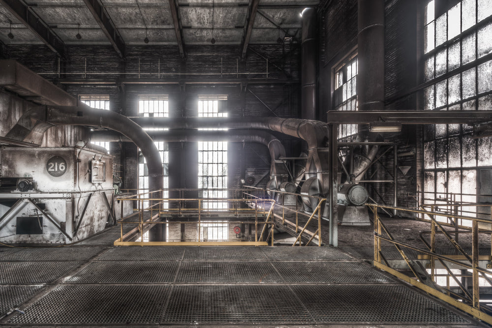 Dust Extraction at Morwell Power Station, steel grating covers the floor of the upper level, gridded and dark with decades.