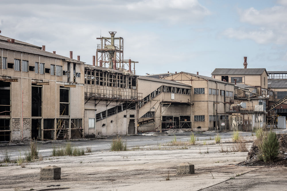 Loading Shed at Morwell Power Station, pale brick buildings stack behind a cracked concrete apron.