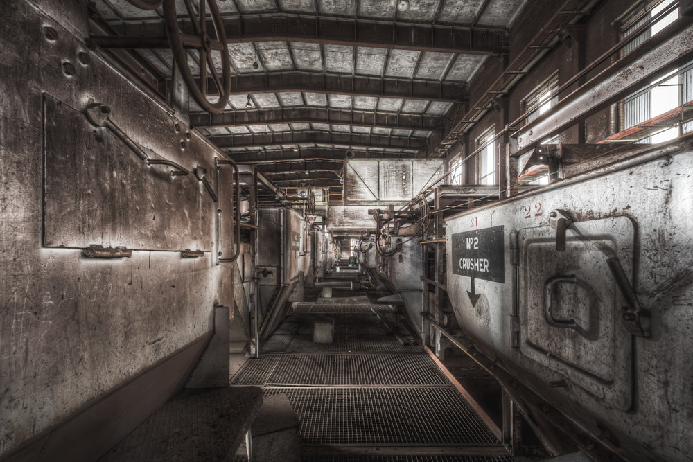 Number 2 Crusher at Morwell Power Station, a steel mesh walkway runs between two rows of crusher housings.